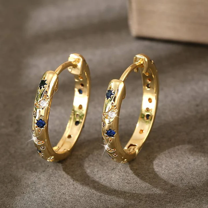 Vintage øreringer i gull med blå zirkonia